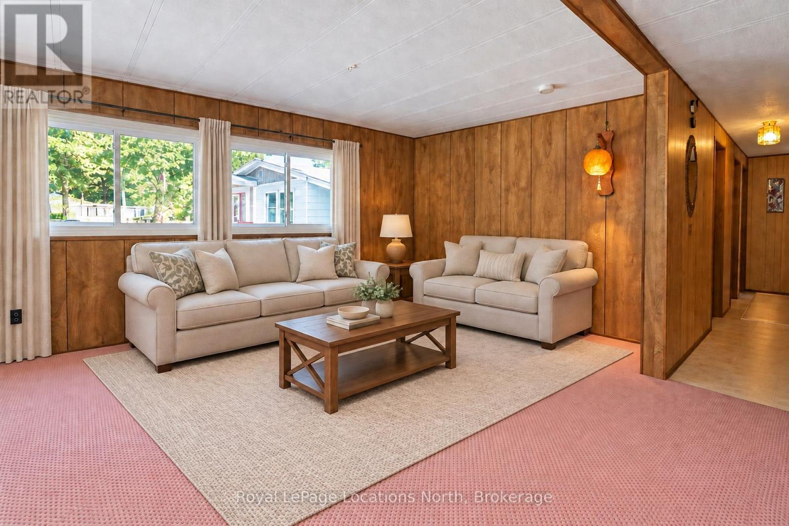 Virtually staged (& open-concept) living room - 16 Sinclair Avenue S, Wasaga Beach, ON