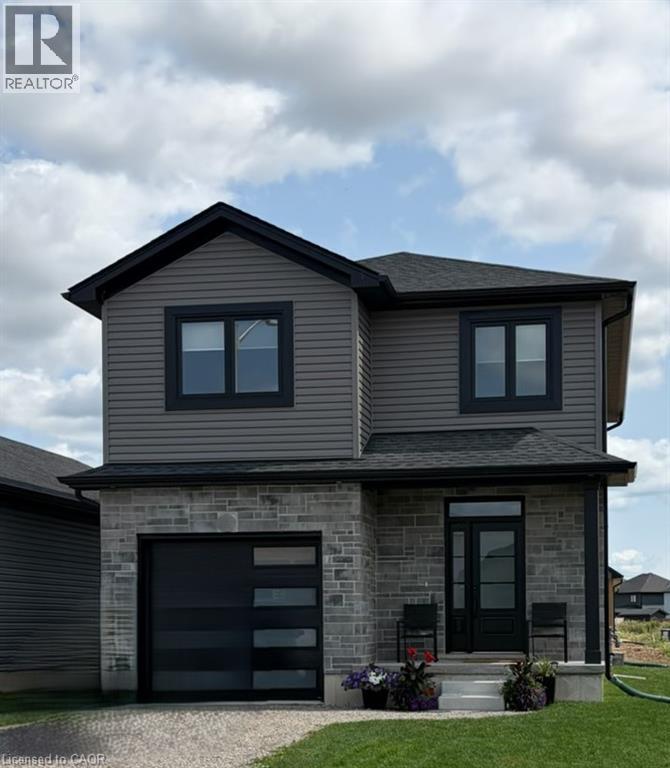 Contemporary two-story residence featuring gray siding and stone facade - 178 Lafayette Street E, Jarvis, ON