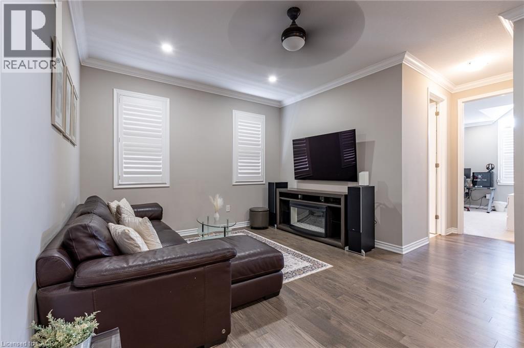 Recessed lighting, crown molding, wood-finish flooring, and white window shutters - 455 Equestrian Way, Cambridge, ON