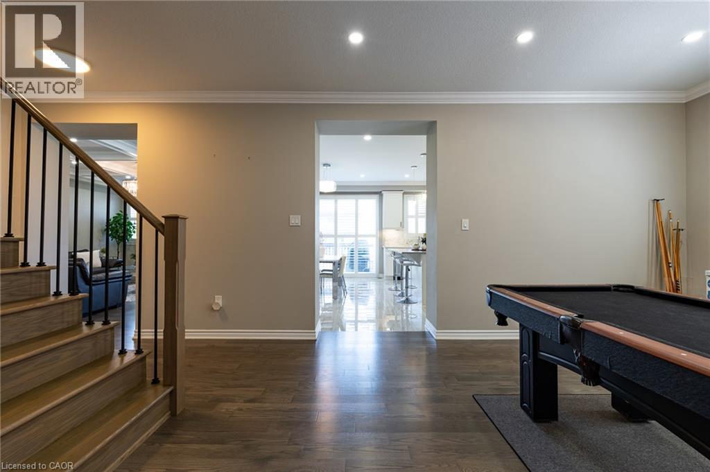 Wood-finish flooring throughout, with recessed lighting and crown molding - 455 Equestrian Way, Cambridge, ON