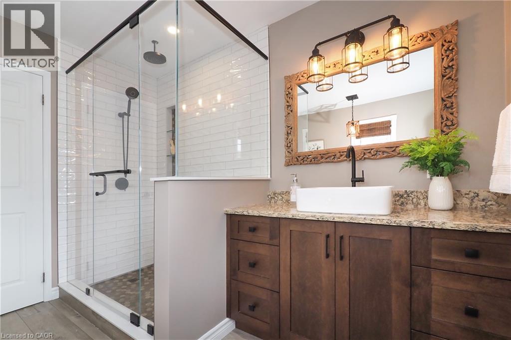 Updated ensuite bathroom with huge soaker tub, two person shower and heated flooring. - 76 Nith River Way, Ayr, ON