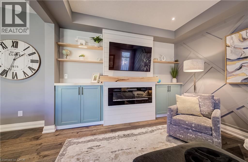 Built-in cabinetry with light blue panel doors, white countertops, and open wood shelving - 35 Greyhawk Street, Kitchener, ON