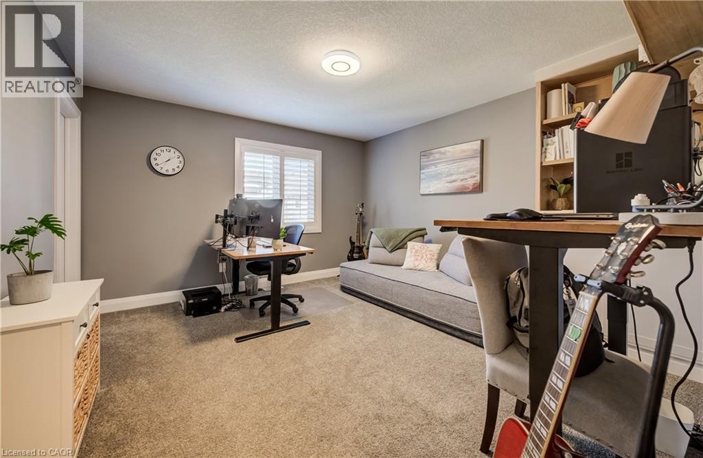 Carpeted flooring, recessed lighting, and built-in shelving - 35 Greyhawk Street, Kitchener, ON