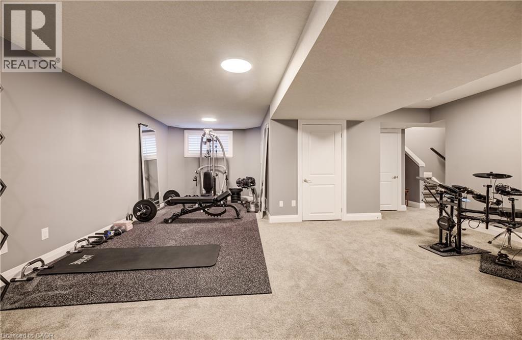 Recessed lighting, painted walls, carpeted flooring, finished ceiling, built-in staircase - 35 Greyhawk Street, Kitchener, ON