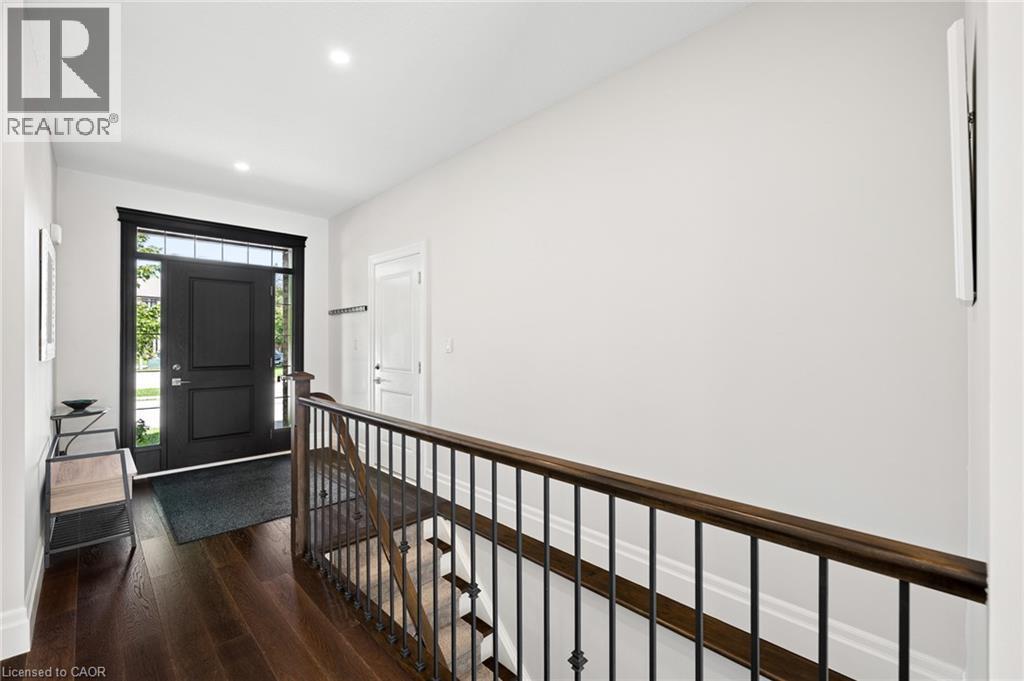 Dark wood-finish flooring Entry door featuring sidelights and a transom - 192 Brewery Street Unit# 18, Baden, ON