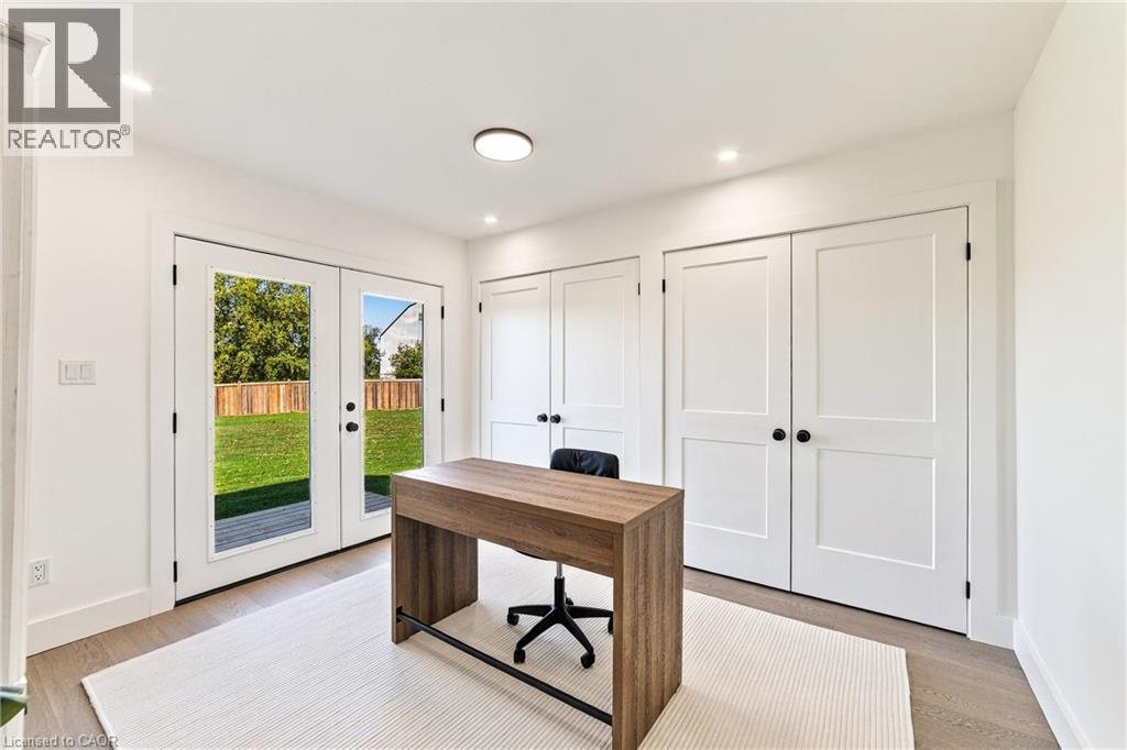 Light wood-finish flooring, recessed lighting, and a flush-mount ceiling light - 5367 2 Side Road, Milton, ON