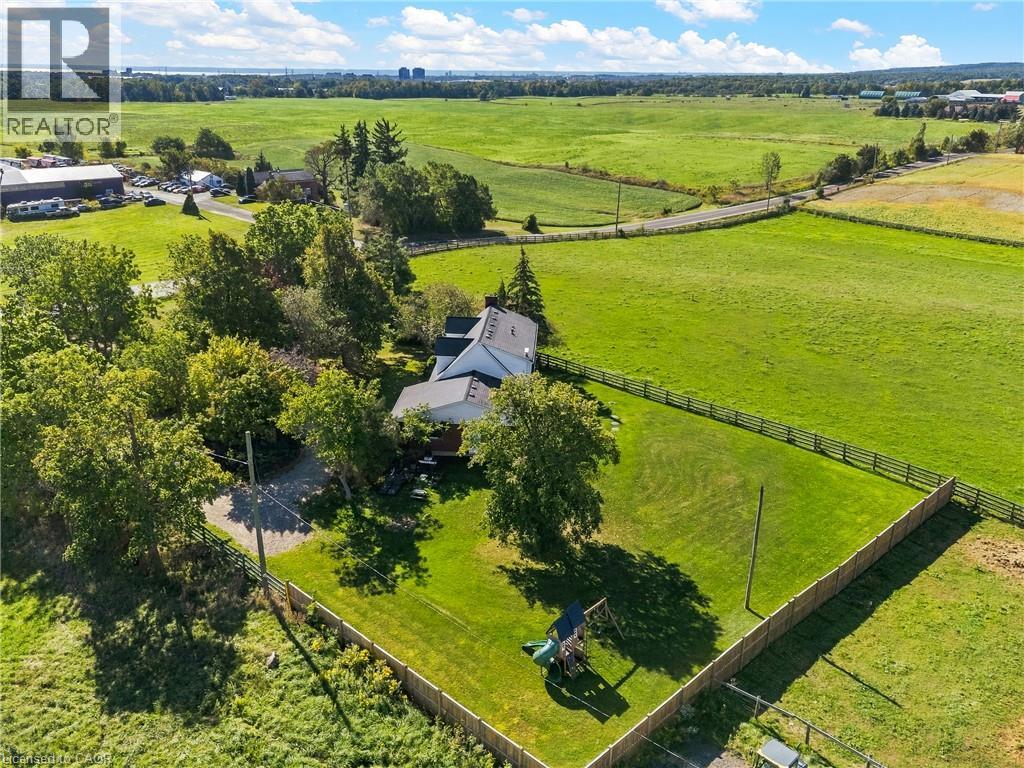 Expansive green space with a fenced perimeter and mature trees - 5367 2 Side Road, Milton, ON