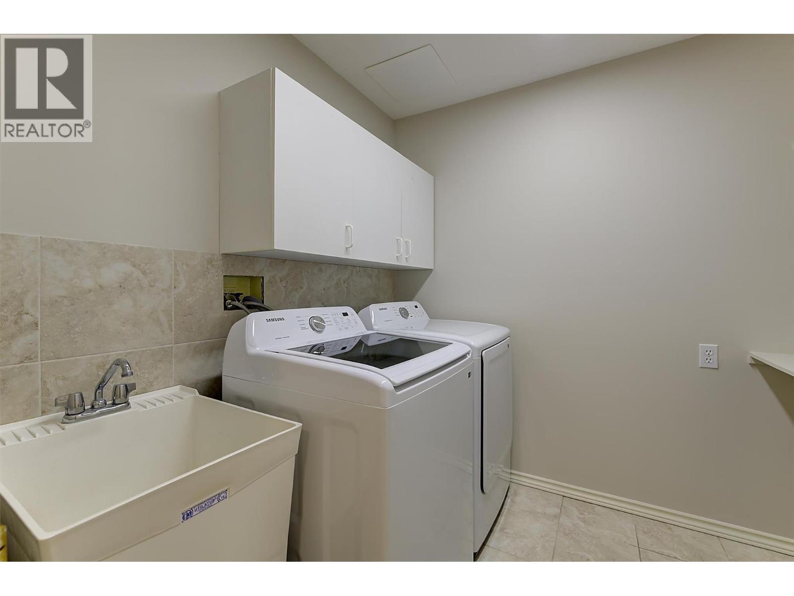 Laundry on the lower level - sink and cabinets - 4632 / 4624 Minto Street, Peachland, BC