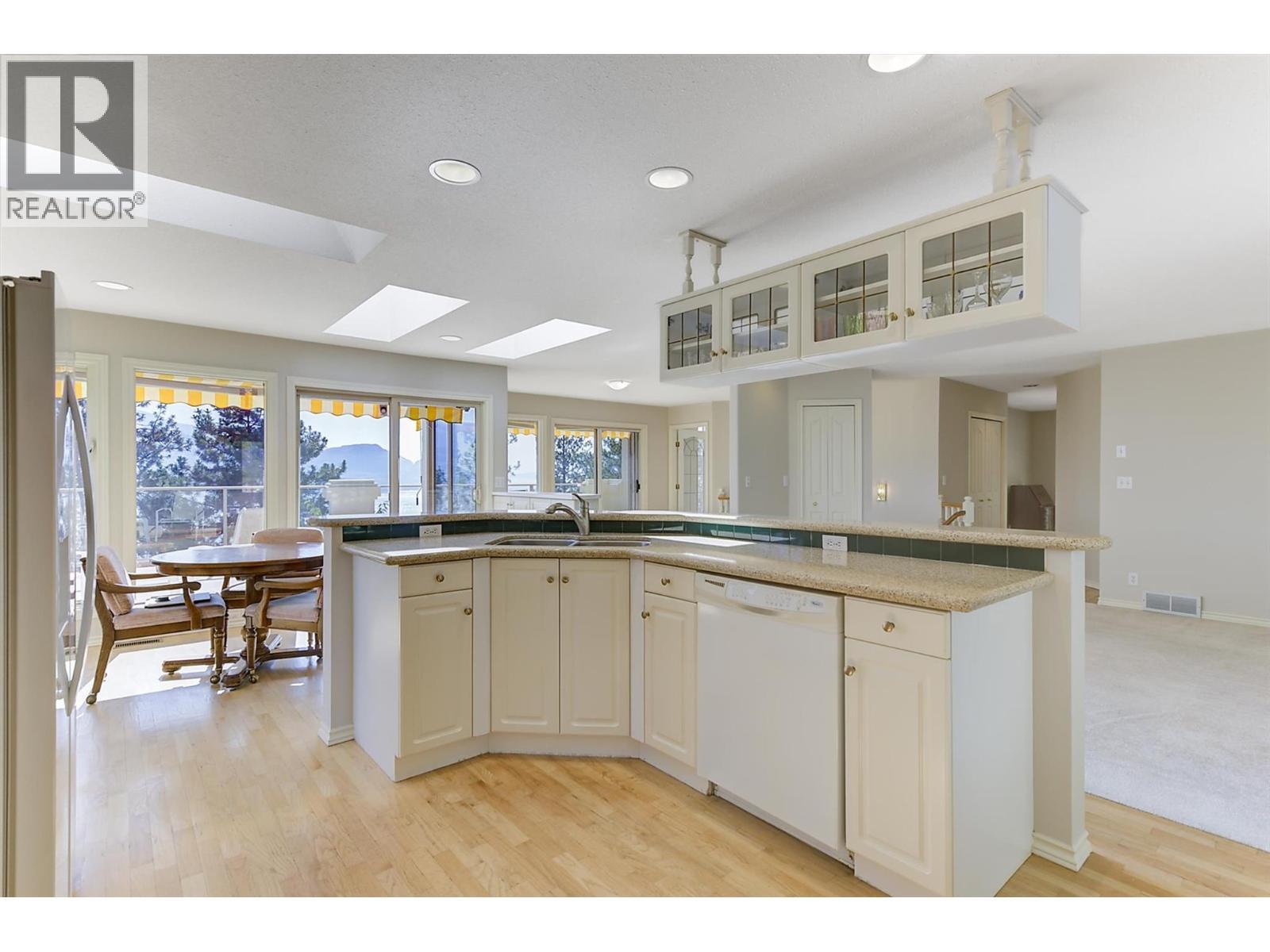 Kitchen to nook and family room - 4632 / 4624 Minto Street, Peachland, BC