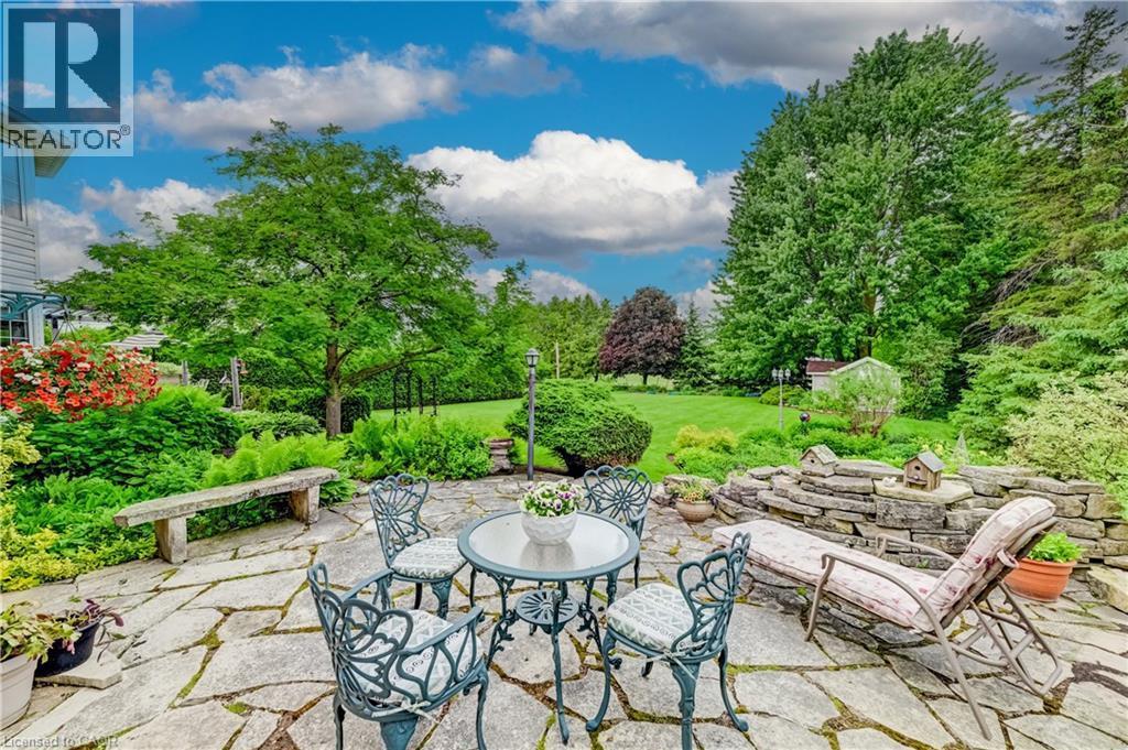 This Flagstone Patio is conveniently located off the living room. - 11 Lorraine Drive, Linwood, ON