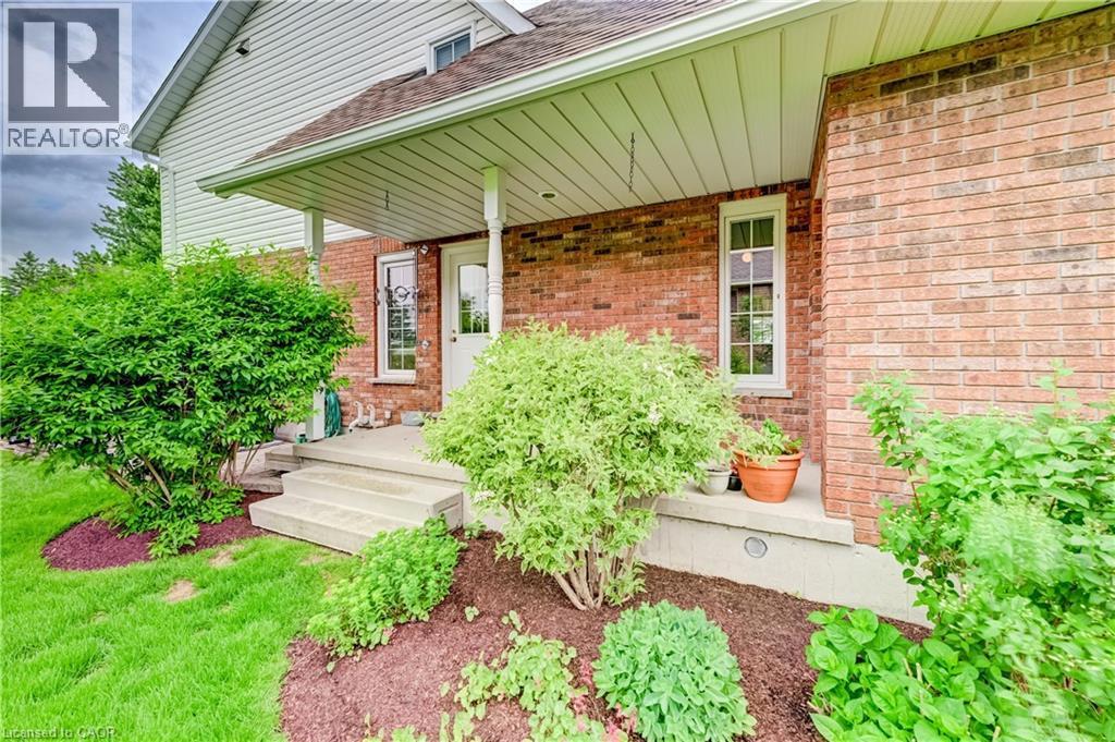 The side porch is conveniently located off the laundry room and gives you access to the clothes line. Enjoy your coffee here then hang your laundry in the fresh air - 11 Lorraine Drive, Linwood, ON