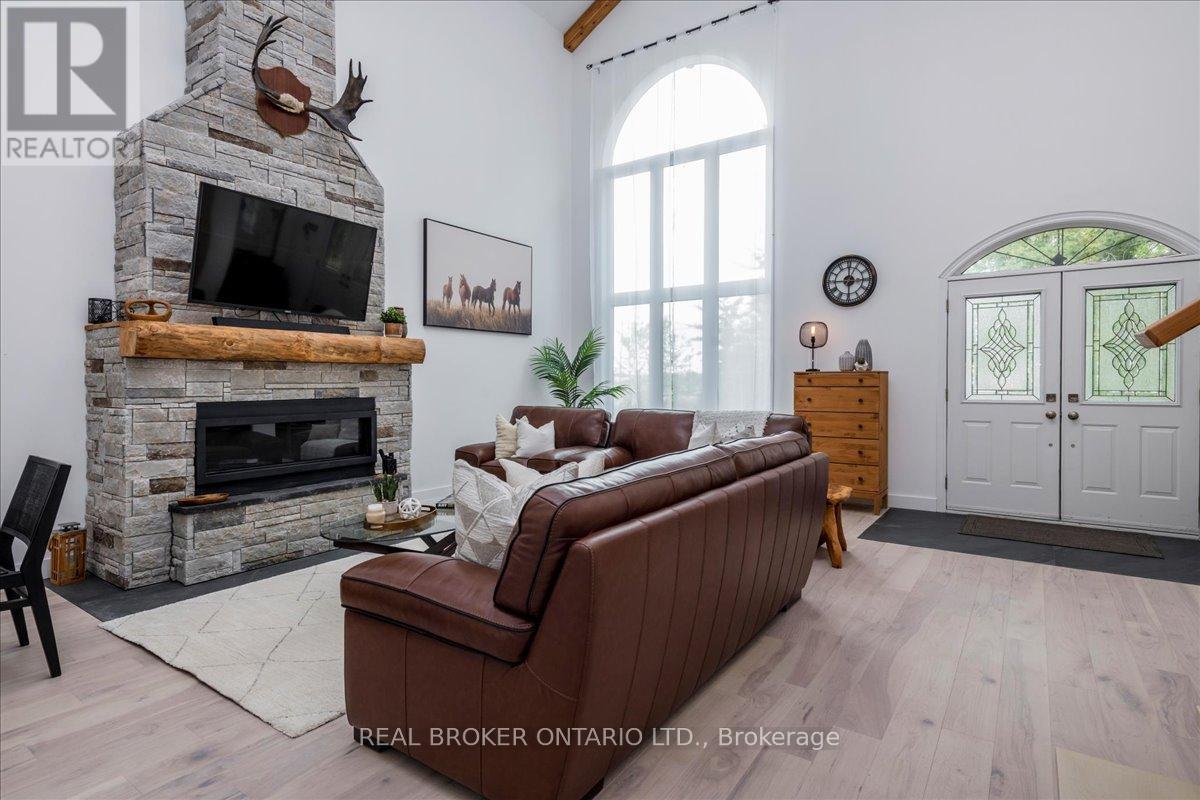 3665 Baldwick Lane, Springwater, ON - Indoor Photo Showing Living Room With Fireplace