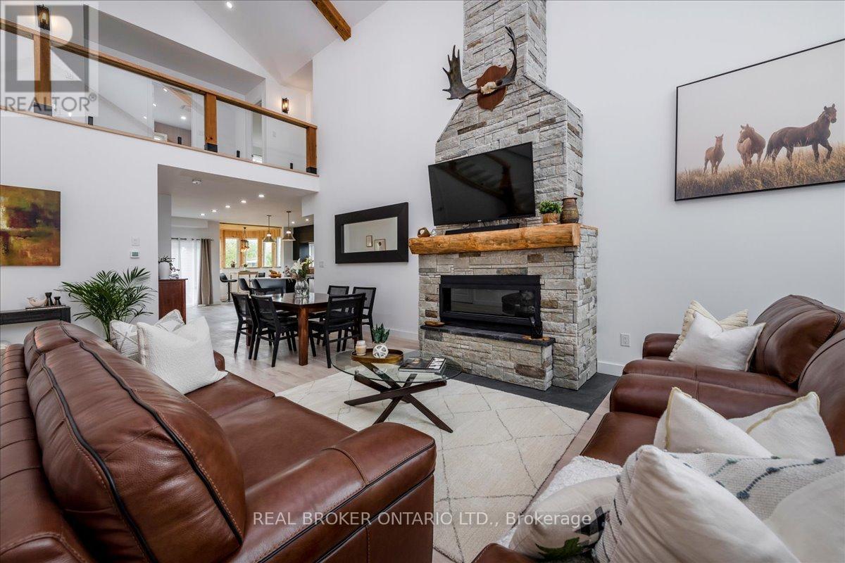 3665 Baldwick Lane, Springwater, ON - Indoor Photo Showing Living Room With Fireplace