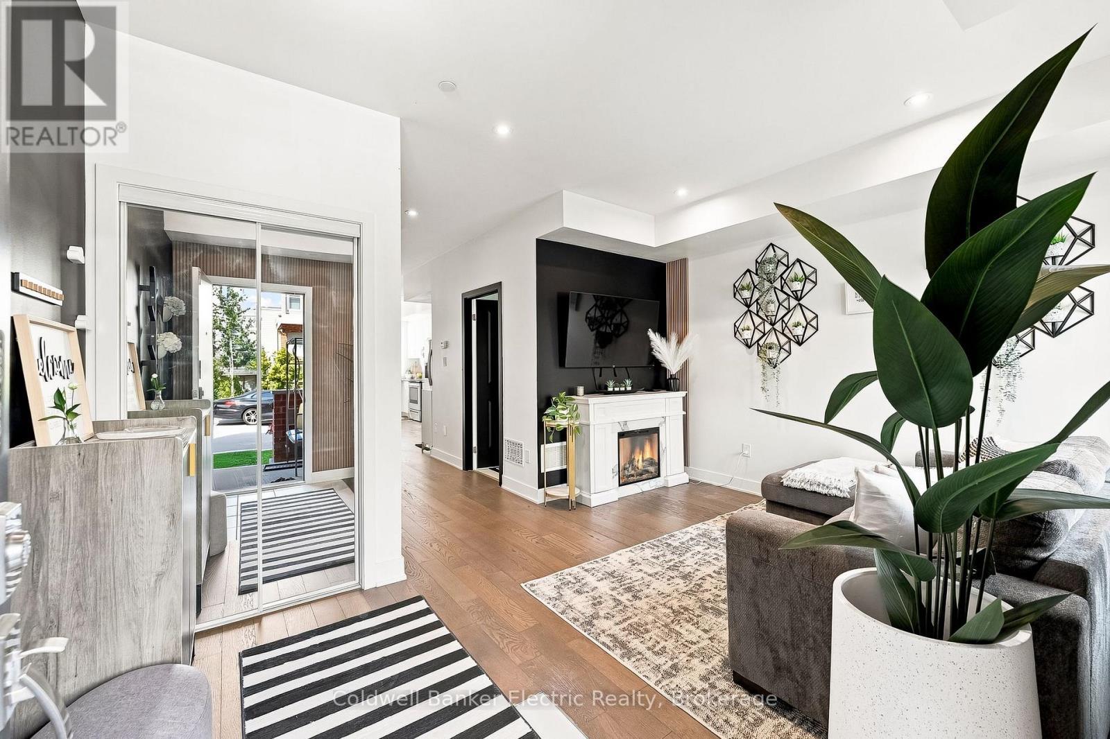42 William Duncan Road, Toronto (Downsview-Roding-Cfb), ON - Indoor Photo Showing Other Room With Fireplace