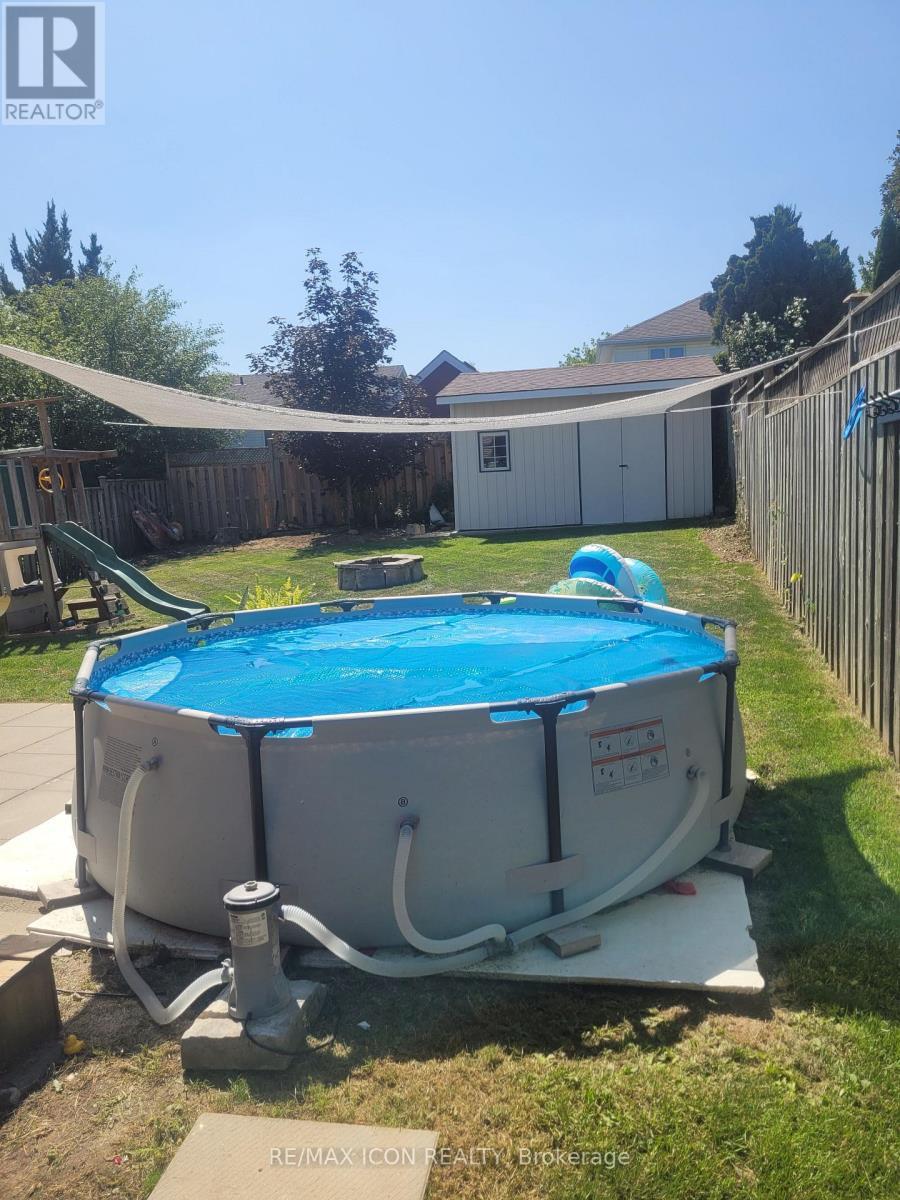 311 Misty Crescent, Kitchener, ON - Outdoor With Above Ground Pool With Backyard