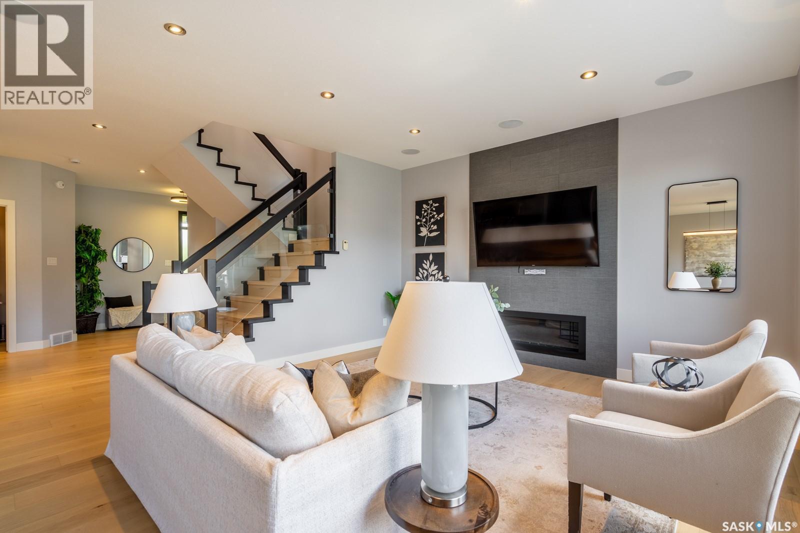 4311 Sandpiper Crescent E, Regina, SK - Indoor Photo Showing Living Room With Fireplace