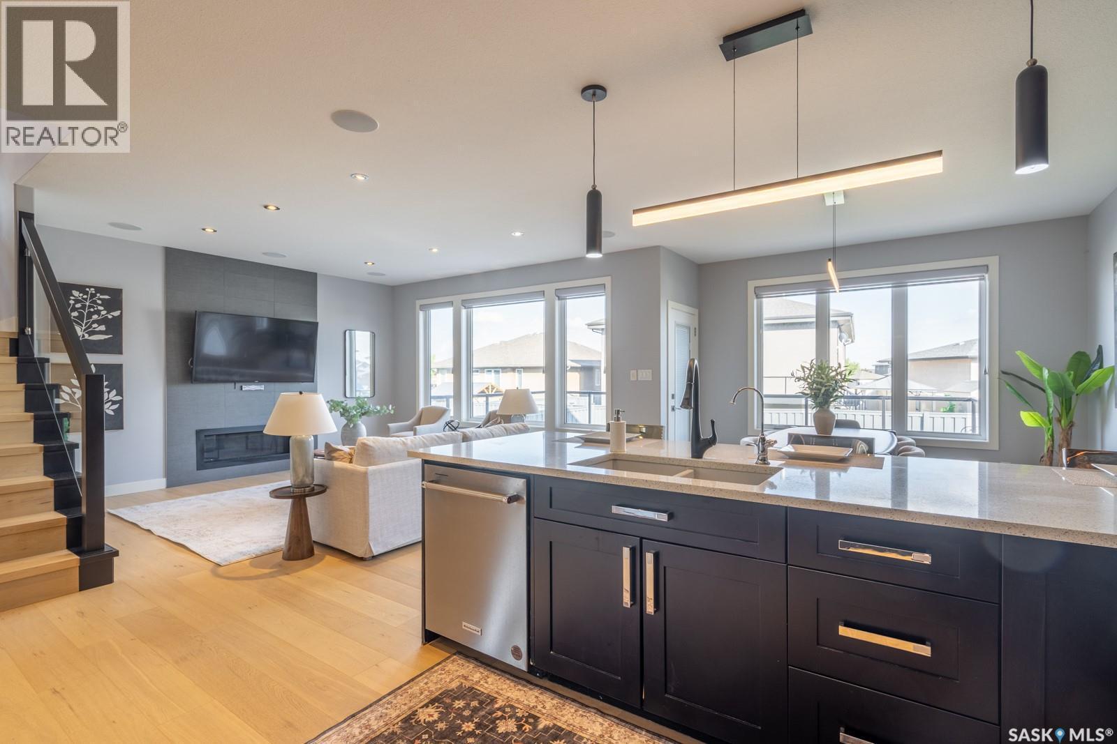 4311 Sandpiper Crescent E, Regina, SK - Indoor Photo Showing Kitchen With Fireplace With Upgraded Kitchen
