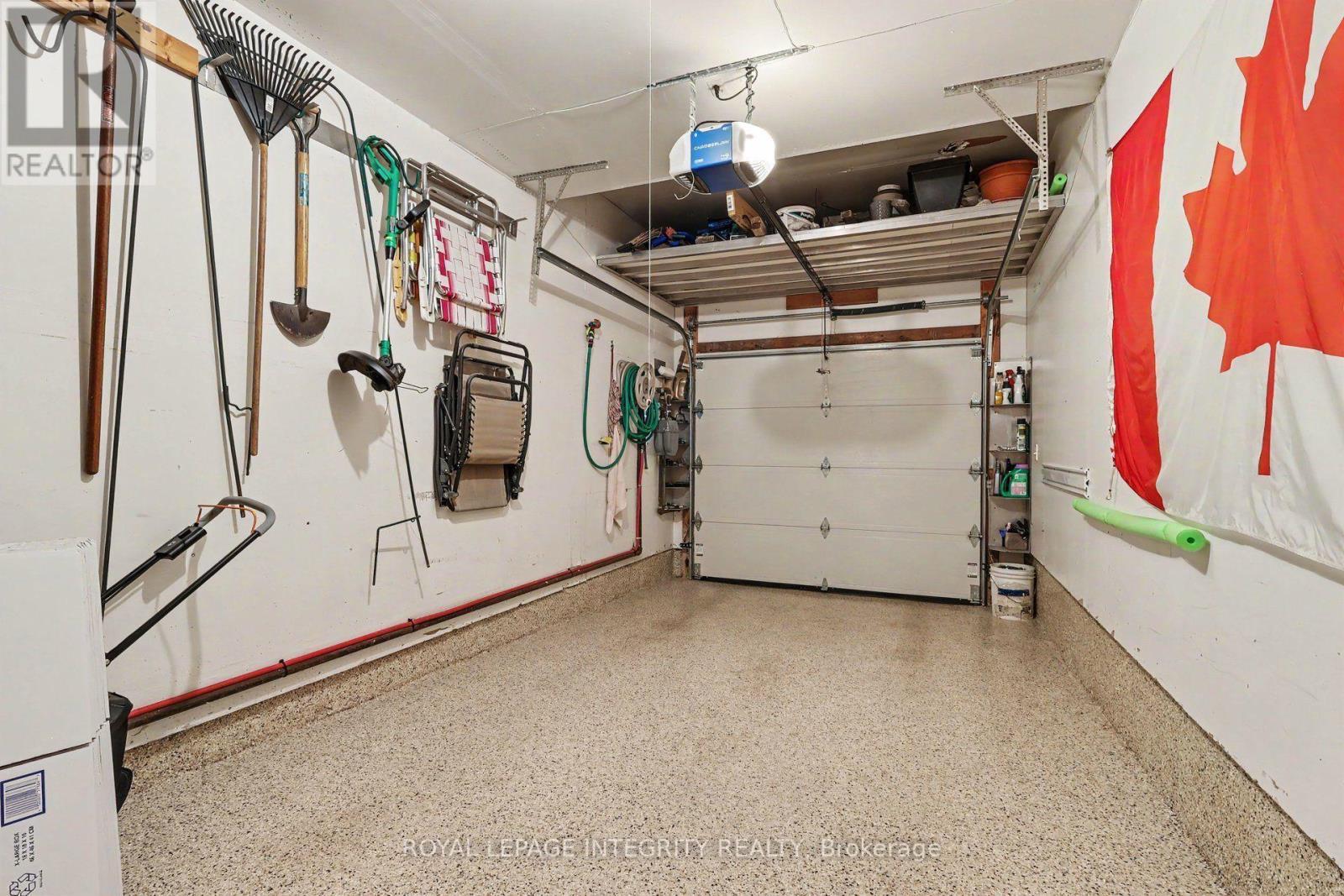 Garage with epoxy flooring - 16 Streamwood Lane, Ottawa, ON - Indoor Photo Showing Garage