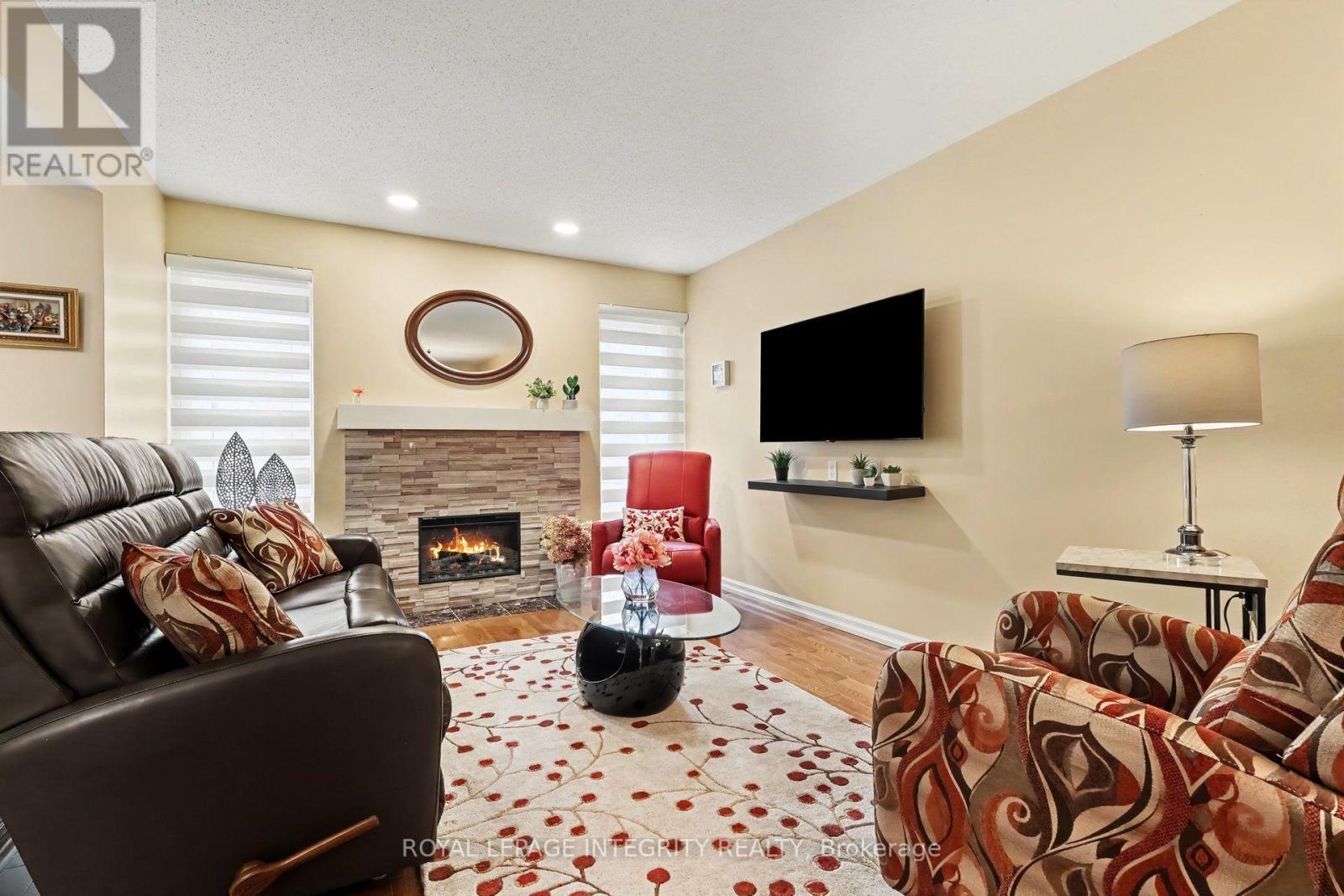 Gas fireplace to take the chill off in the winter - 16 Streamwood Lane, Ottawa, ON - Indoor Photo Showing Living Room With Fireplace
