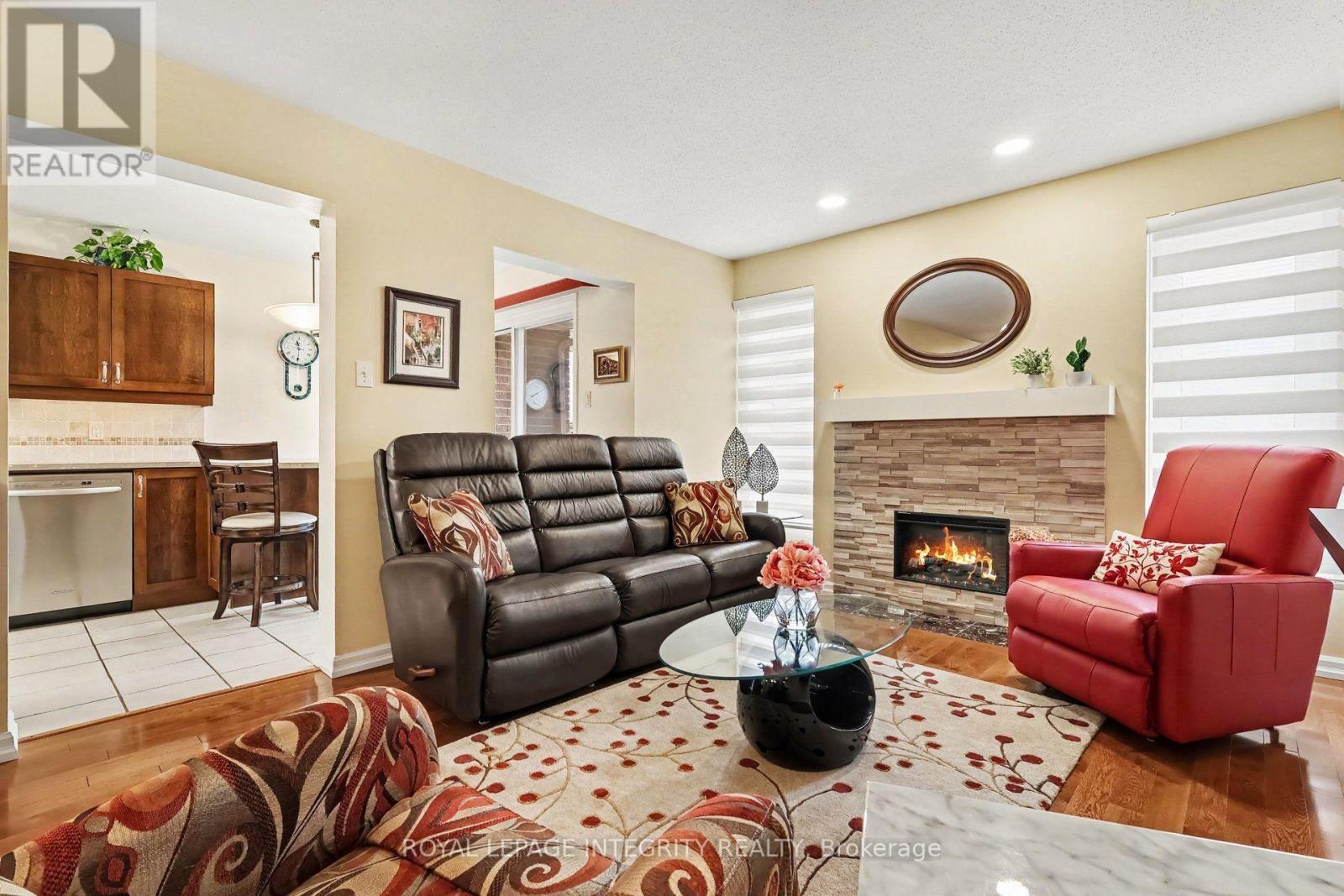 Living room for family gathering - 16 Streamwood Lane, Ottawa, ON - Indoor Photo Showing Living Room With Fireplace