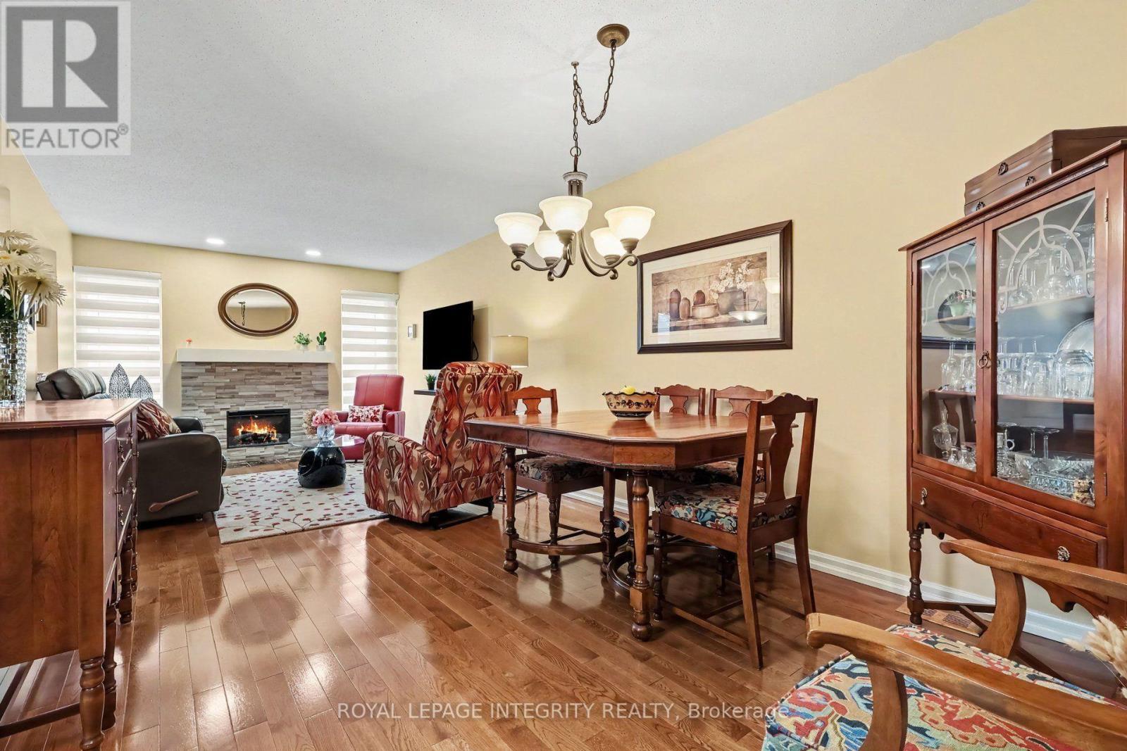 Dining area - 16 Streamwood Lane, Ottawa, ON - Indoor Photo Showing Dining Room With Fireplace