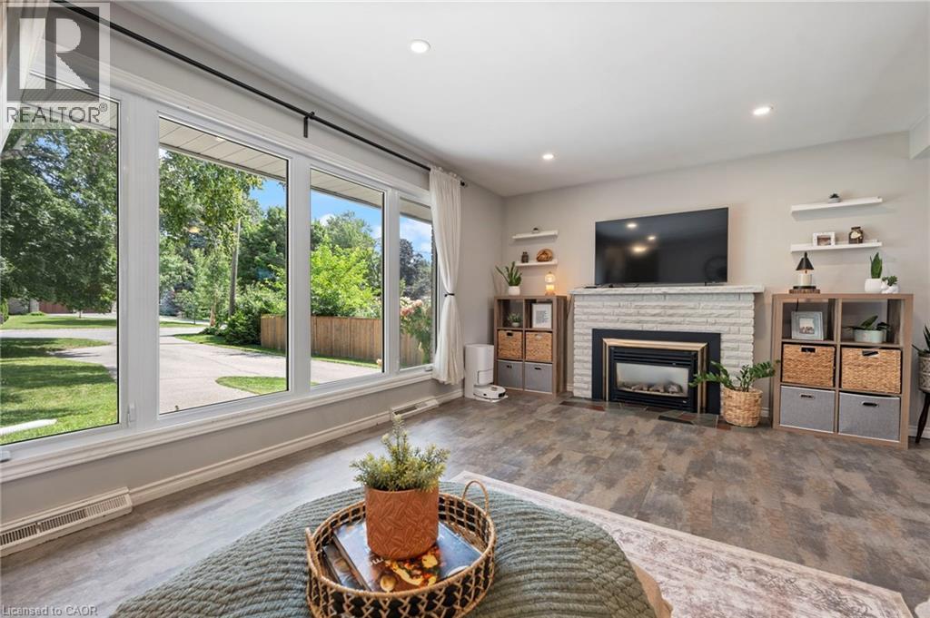 16 Gibson Drive, Simcoe, ON - Indoor Photo Showing Living Room With Fireplace