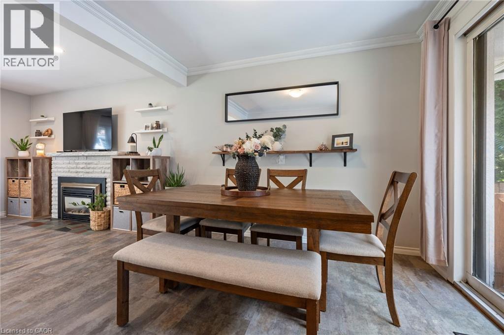 16 Gibson Drive, Simcoe, ON - Indoor Photo Showing Dining Room With Fireplace