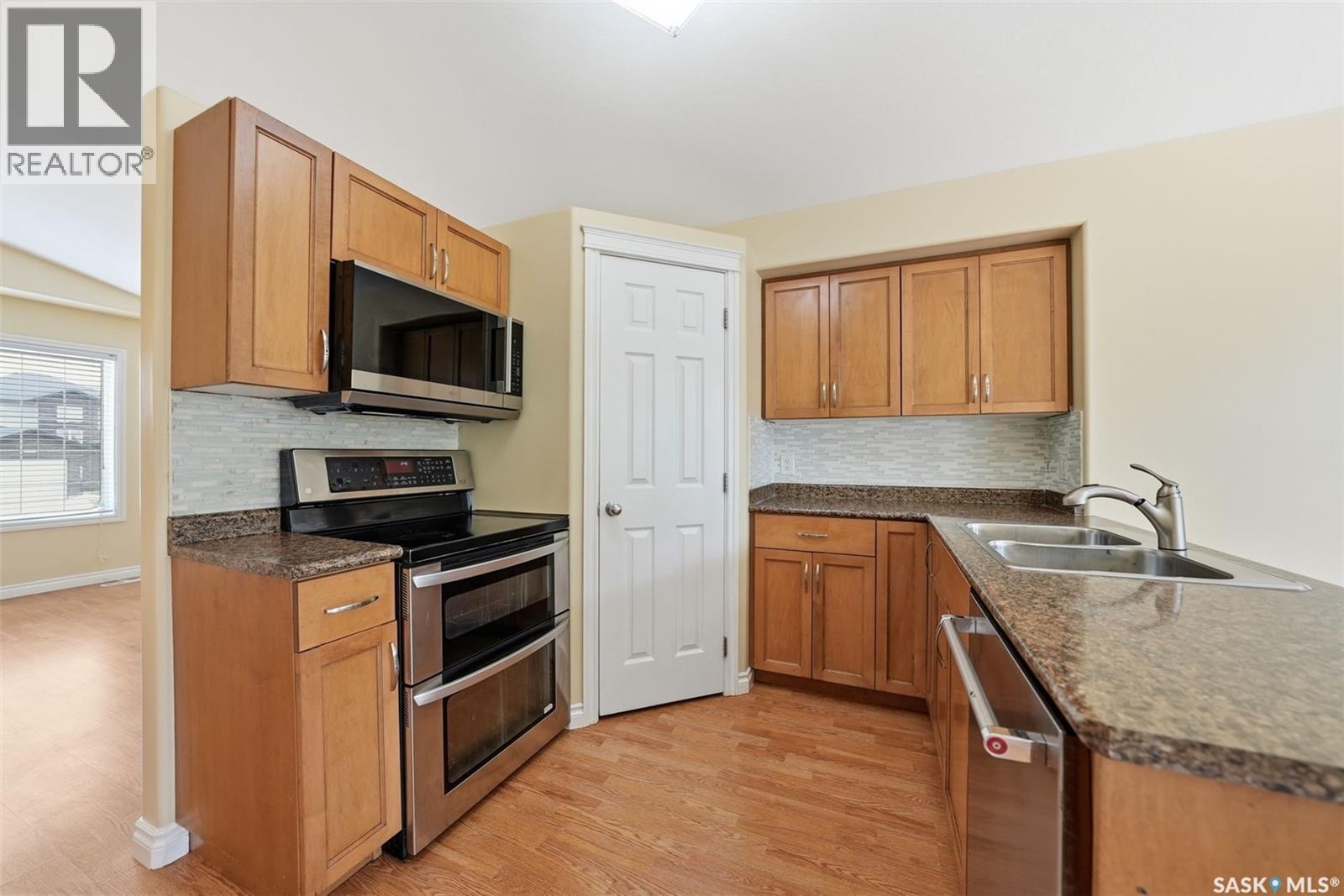 110 Bennion Crescent, Saskatoon, SK - Indoor Photo Showing Kitchen With Stainless Steel Kitchen With Double Sink