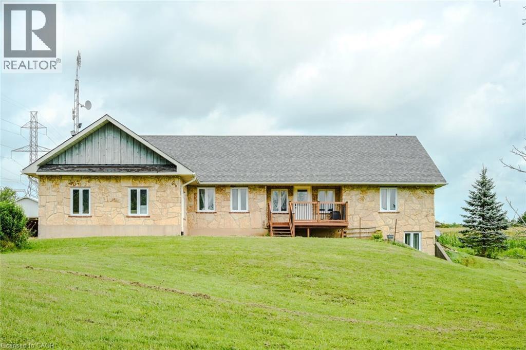 Stone veneer exterior with multiple windows - 107 6Th Line Line, Haldimand, ON - Outdoor