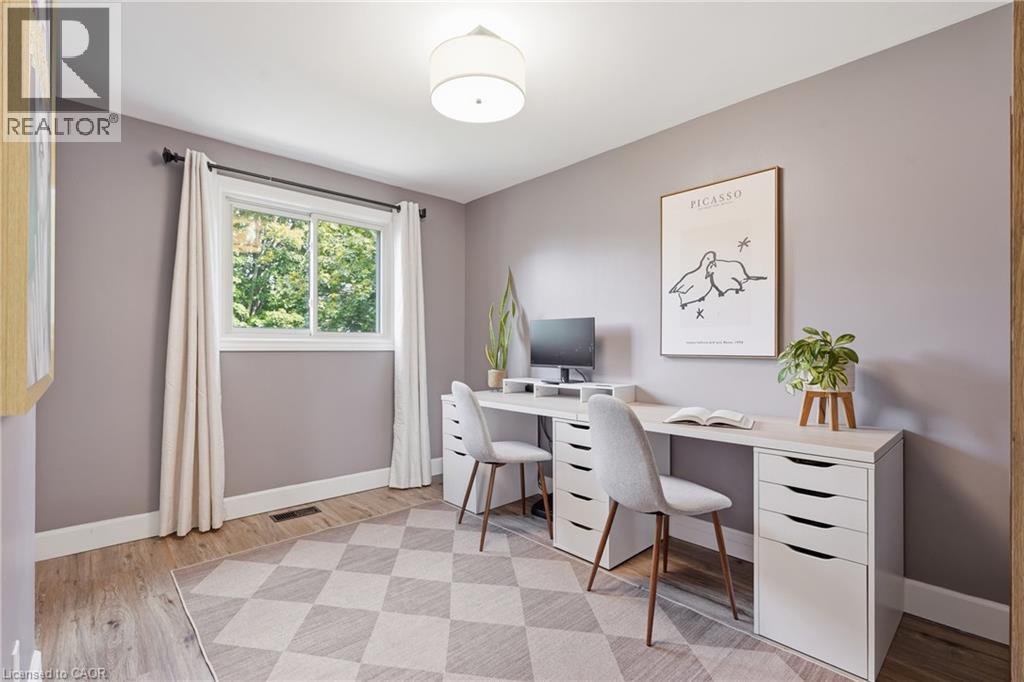 Wood-finish flooring, recessed lighting, neutral wall tones, and a window with natural light - 563 Westvale Drive, Waterloo, ON - Indoor Photo Showing Office