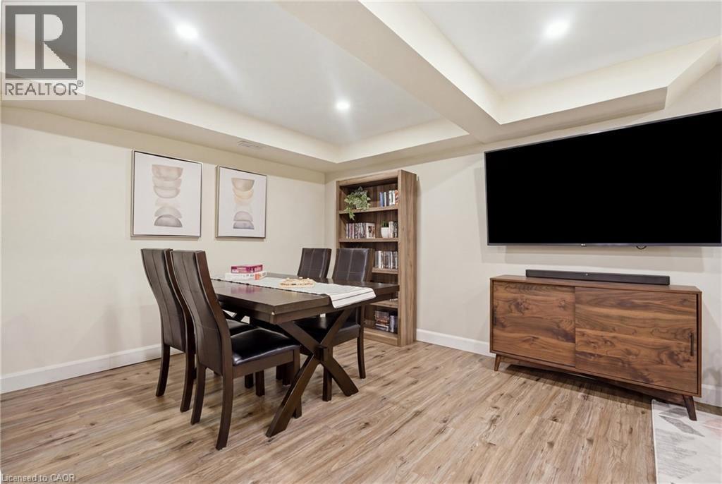 Recessed lighting, wood-finish flooring, and light-toned walls - 563 Westvale Drive, Waterloo, ON - Indoor Photo Showing Dining Room