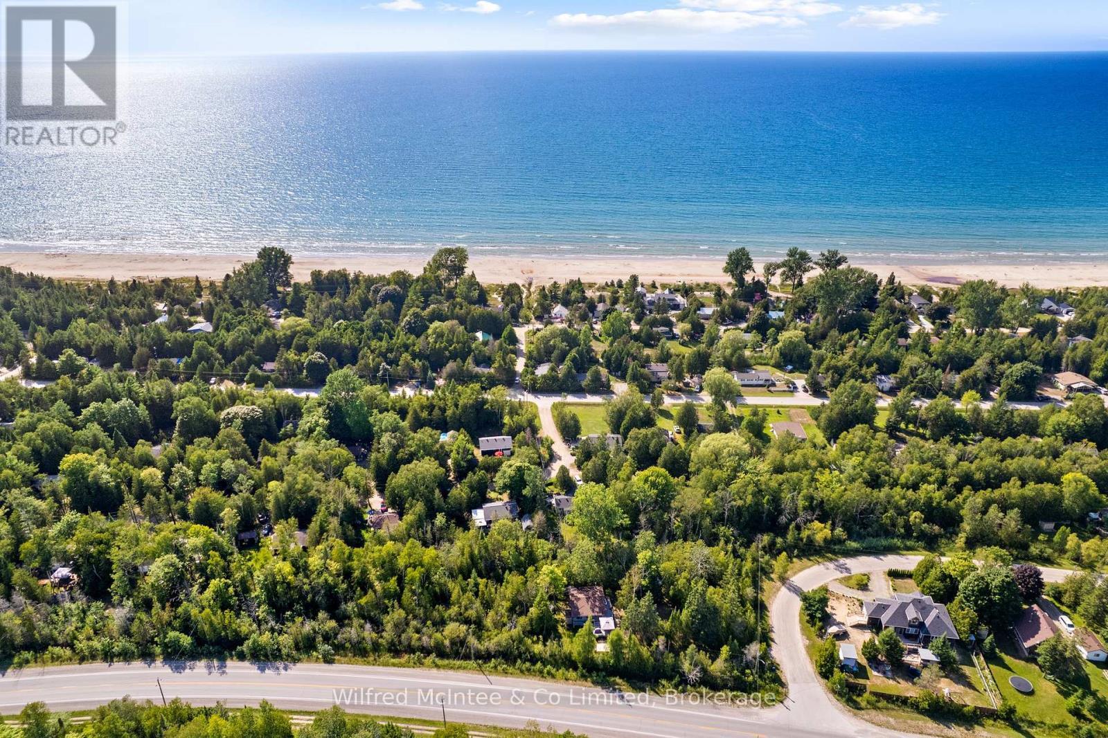 Steps to sandy beach at 14th - 32 Mohawk Drive, Native Leased Lands, ON - Outdoor With Body Of Water With View