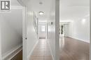 Foyer featuring tiled flooring and direct access to a staircase with white railings - 23 Heatherdale Place, Hamilton, ON  - Indoor Photo Showing Other Room 