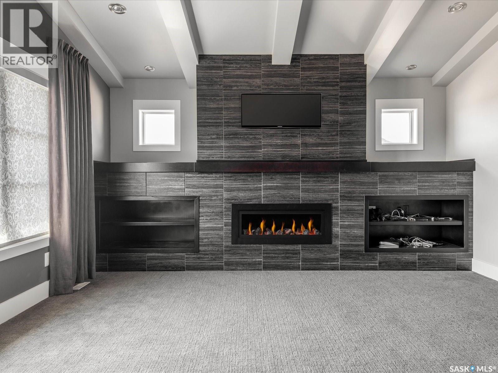 3633 Green Water Drive, Regina, SK - Indoor With Fireplace