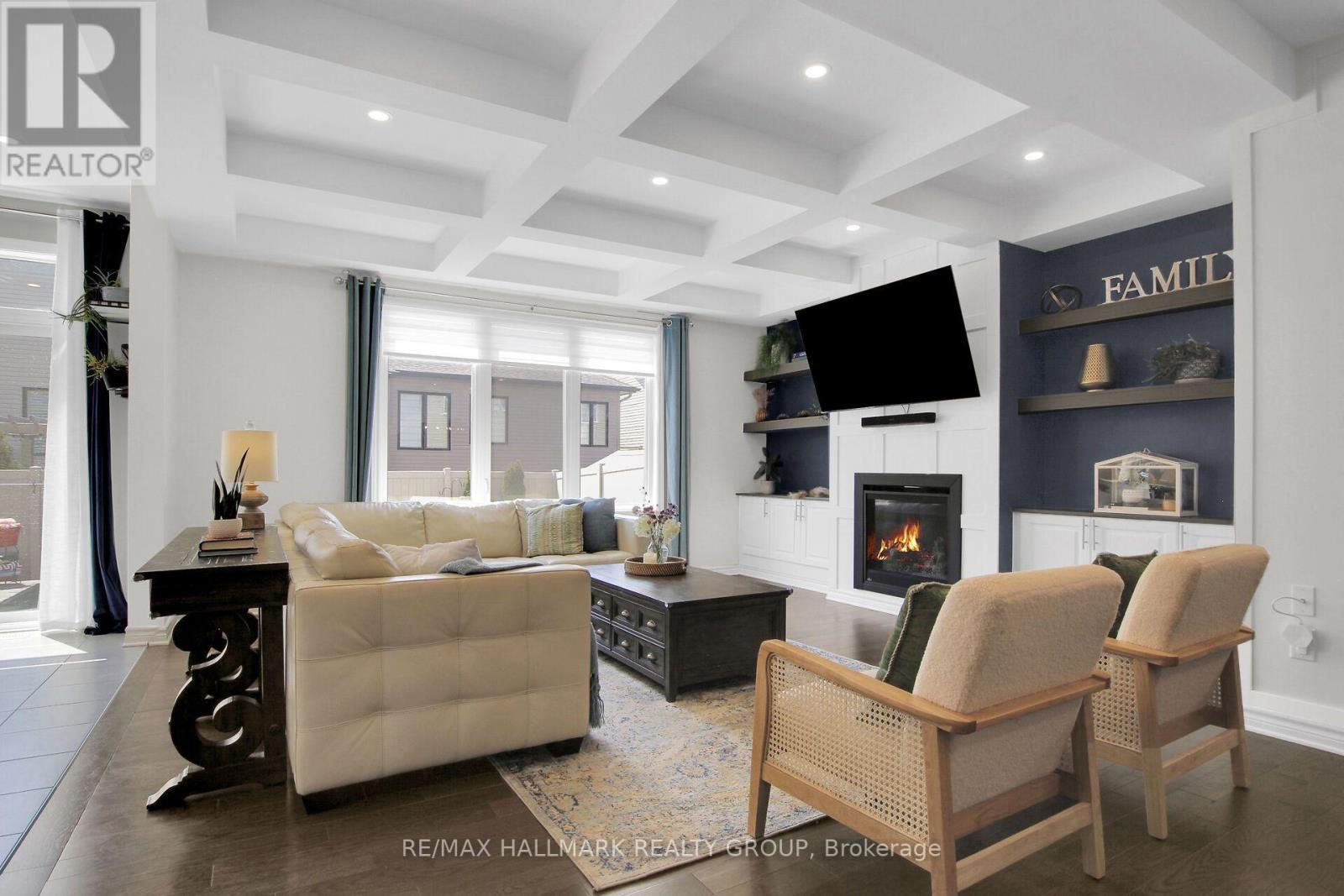 Family room with coffered ceiling - 636 Eagle Crest Heights, Ottawa, ON - Indoor Photo Showing Living Room With Fireplace