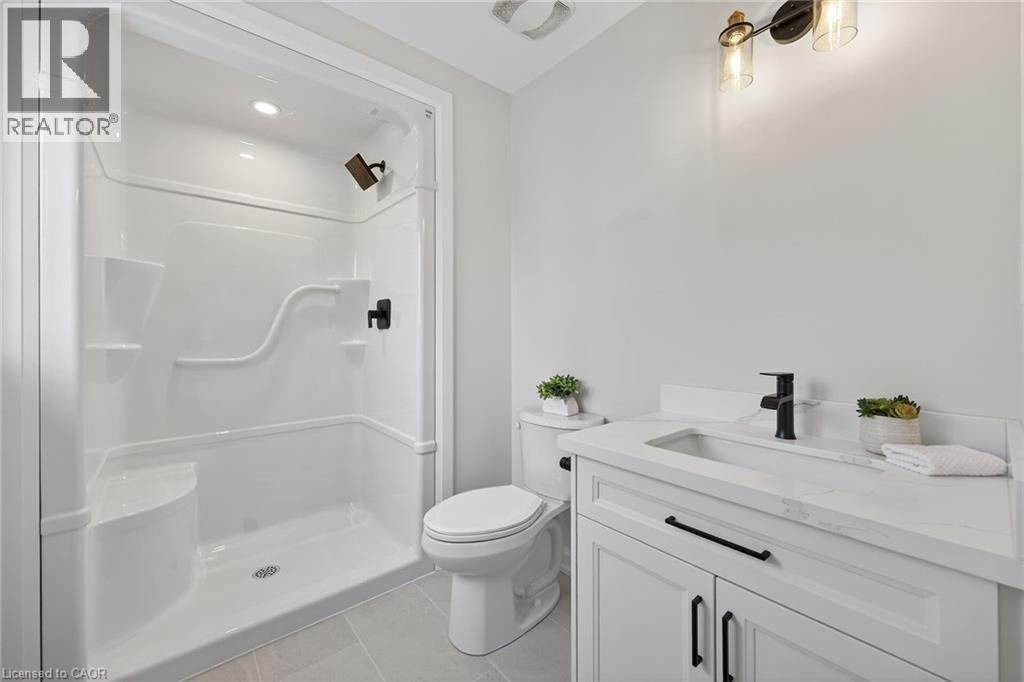 Ensuite bathroom, with shower surround and quartz counters. - 45B Howard Street, Hagersville, ON
