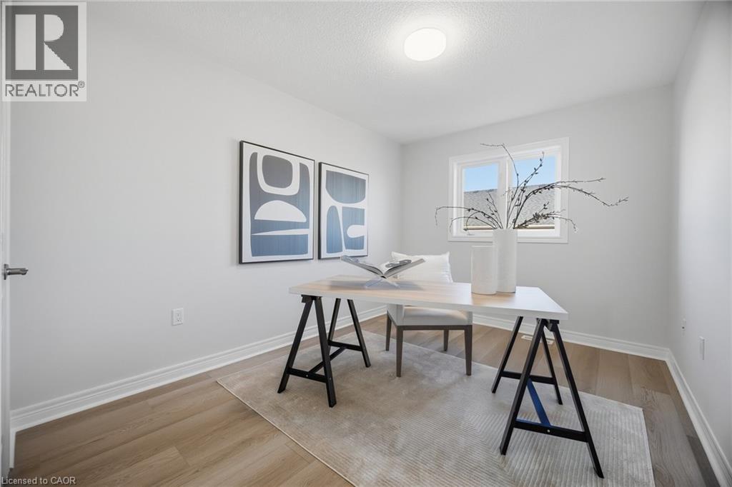 Recessed lighting, light-toned wood-finish flooring, white trim, and a window with white casing - 98 Bloom Crescent, Stoney Creek, ON