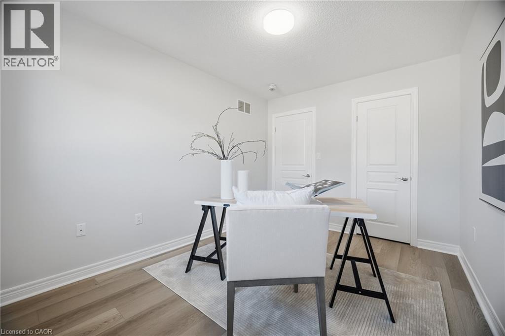 Recessed lighting, wood-finish flooring, white trim, and white paneled doors - 98 Bloom Crescent, Stoney Creek, ON