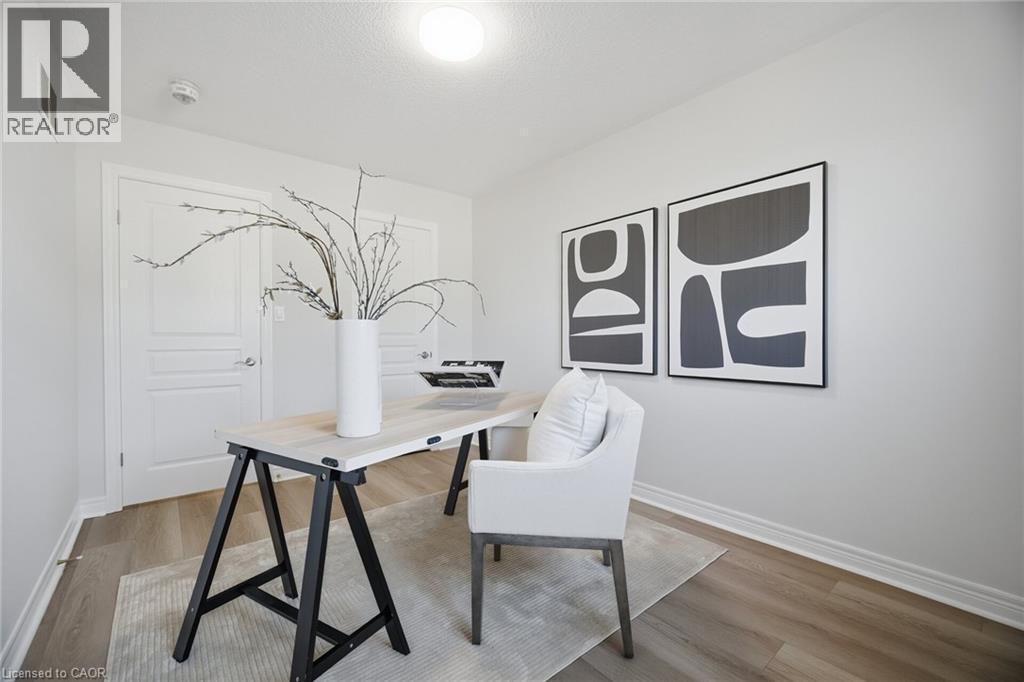 Dual white paneled doors, light wood-finish flooring, white walls, and recessed lighting - 98 Bloom Crescent, Stoney Creek, ON
