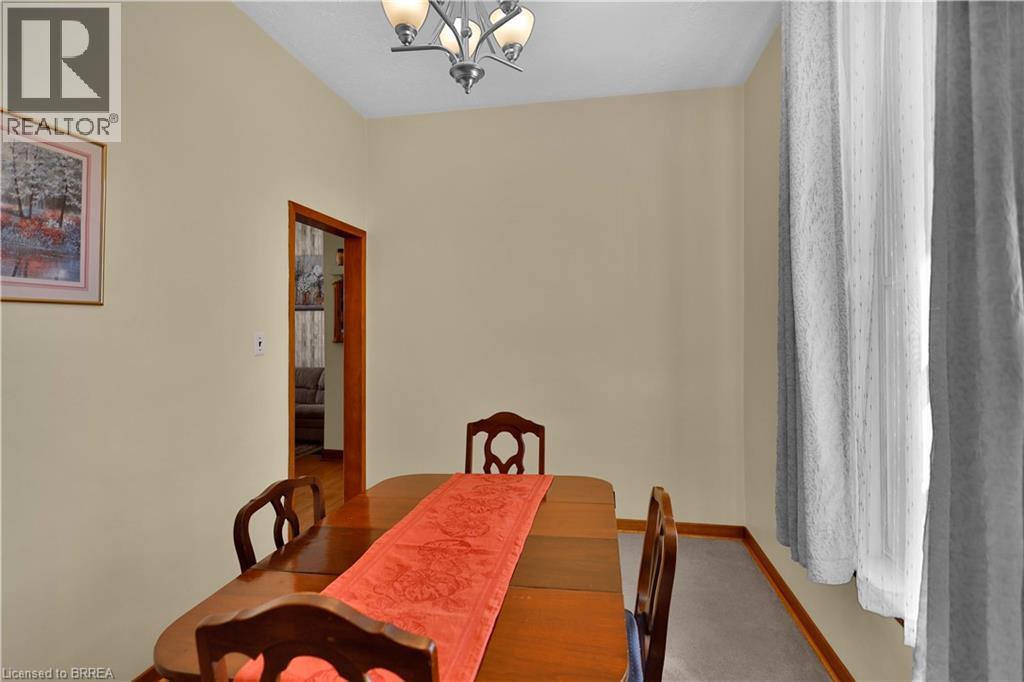 Recessed lighting, wood-finish trim, carpeting, and a chandelier - 7 Halls Avenue, Brantford, ON