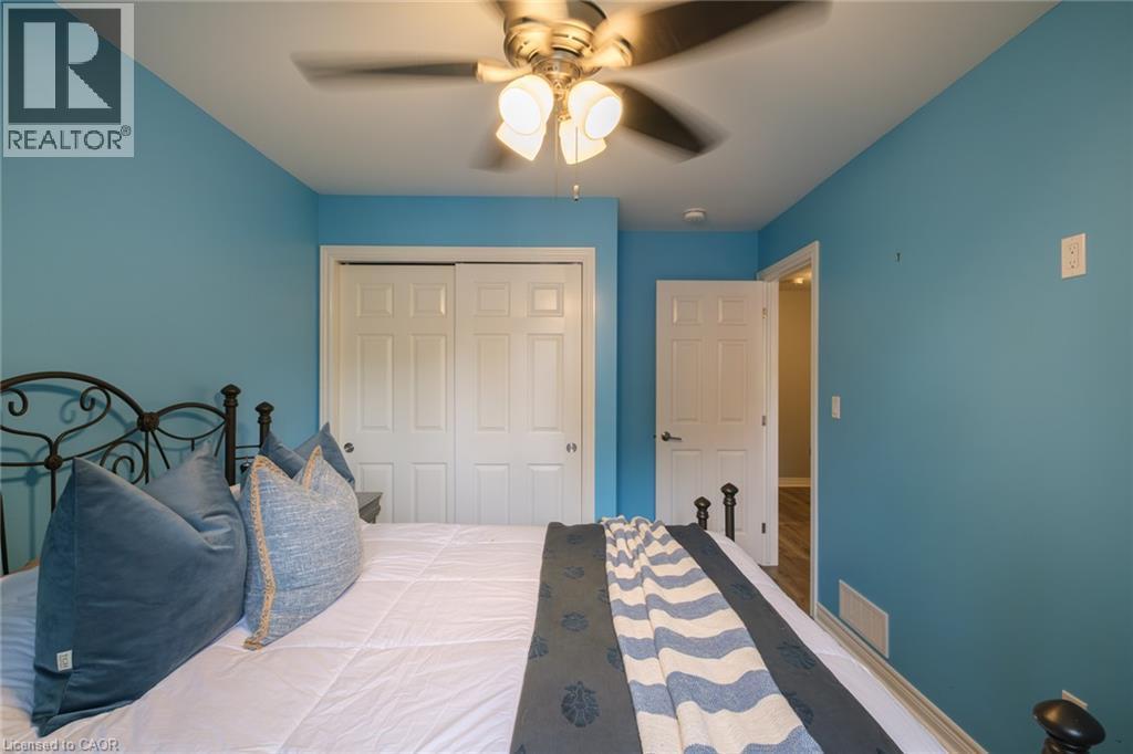 Ceiling fan light fixture, sliding closet doors, and interior door with lever hardware - 78 Oak Street, Simcoe, ON
