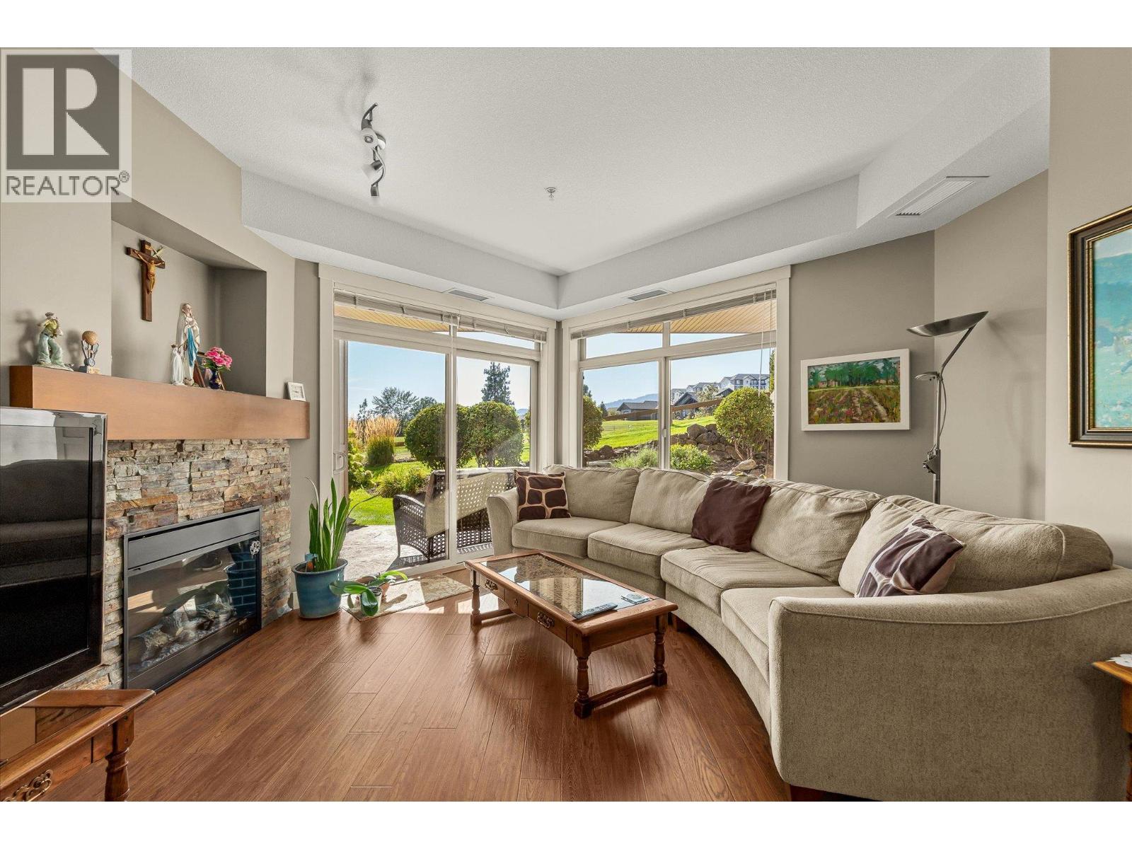 High ceilings and picture windows are all about the Views.. - 3545 Carrington Road Unit# 108, West Kelowna, BC