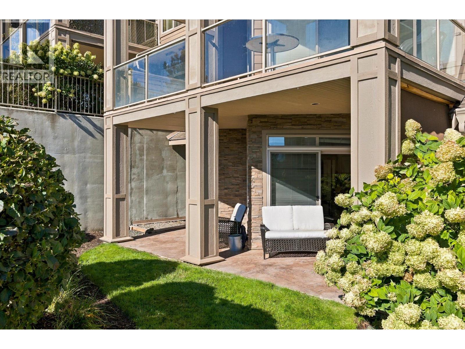 2 entrances to the large corner patio. - 3545 Carrington Road Unit# 108, West Kelowna, BC