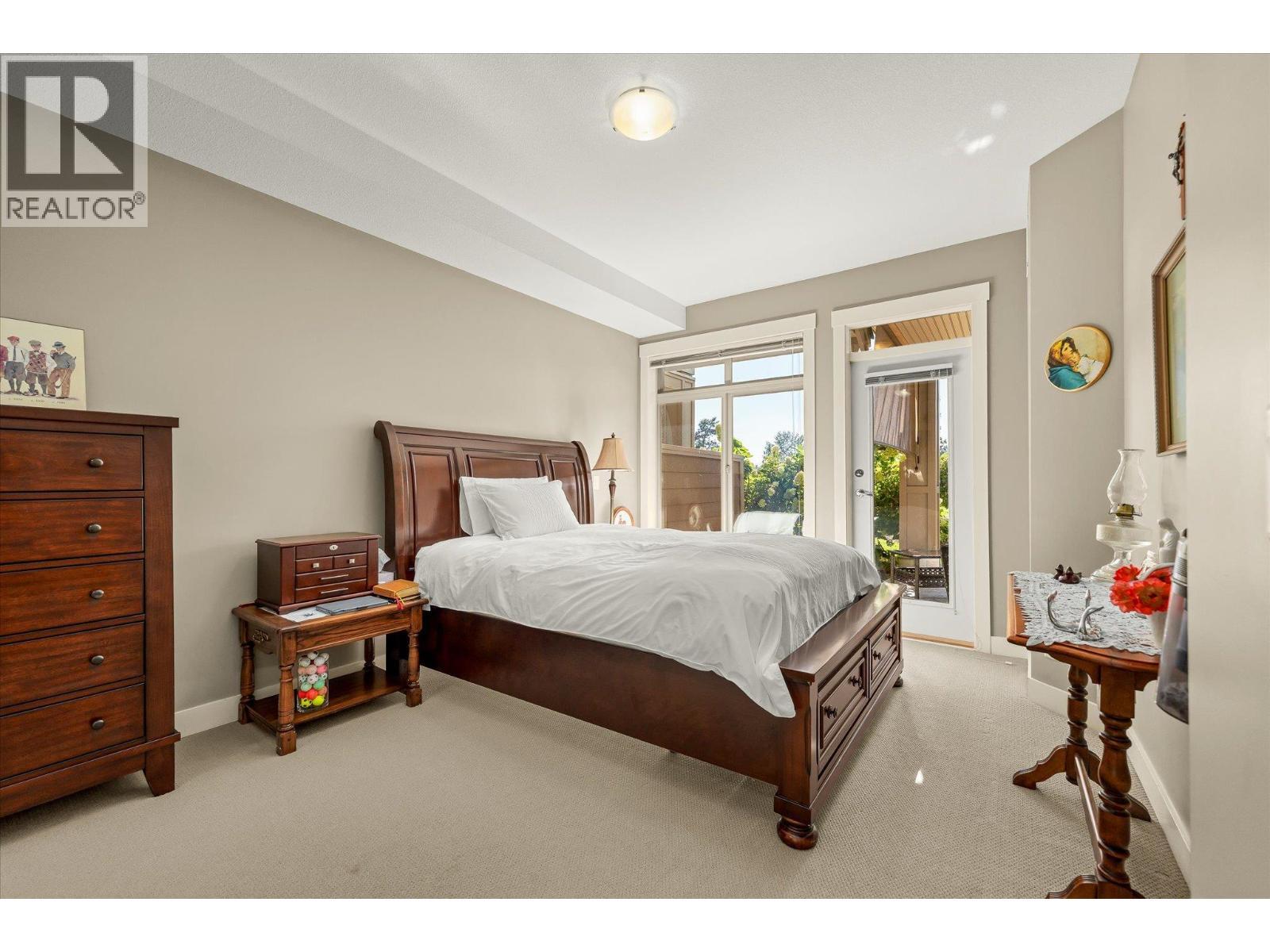 Primary bedroom boasts a walk out to the patio. - 3545 Carrington Road Unit# 108, West Kelowna, BC