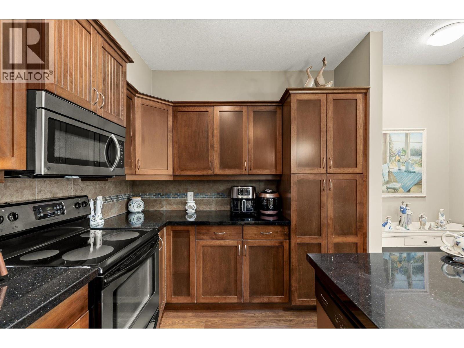 Tons of cupboards and a pantry. - 3545 Carrington Road Unit# 108, West Kelowna, BC