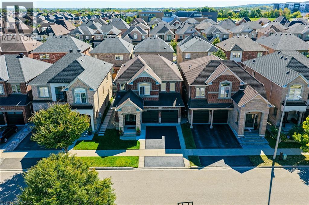 Traditional brick and stone facade with a prominent gabled roofline - 3352 Hiscott Avenue, Burlington, ON