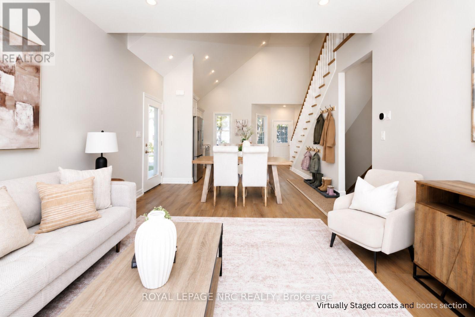 Virtually staged coats and boots section. - 3 Peel Street, St. Catharines (Port Dalhousie), ON