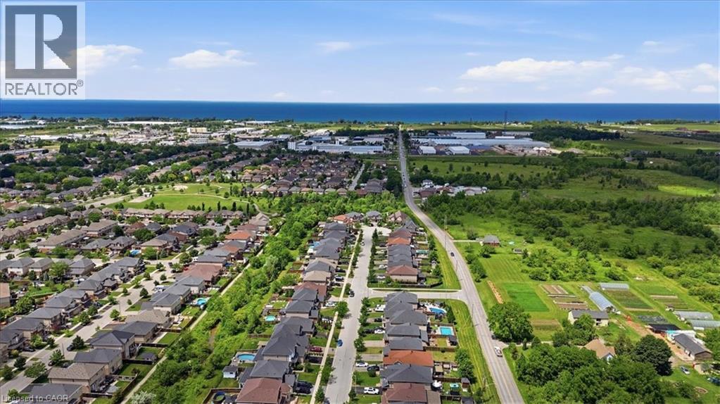 Expansive residential area with a prominent water body in the background - 4804 John Street, Beamsville, ON