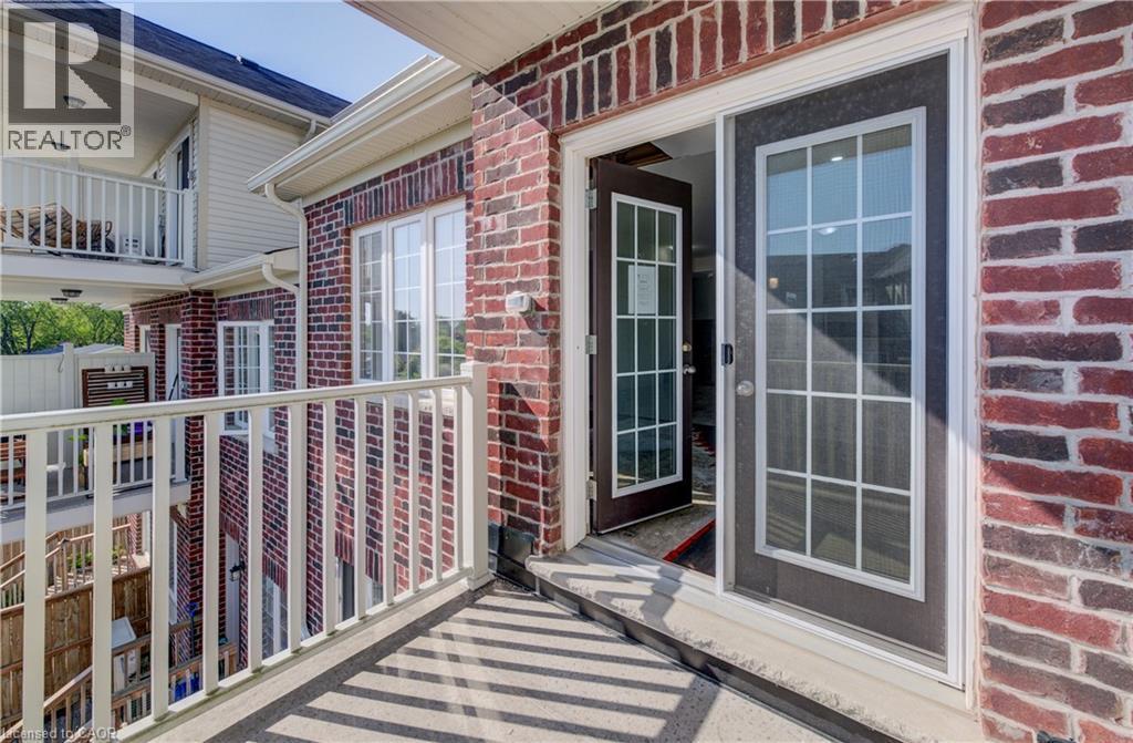 Upper-level balcony featuring white railings and a concrete floor - 403 Westwood Drive Unit# 59, Kitchener, ON