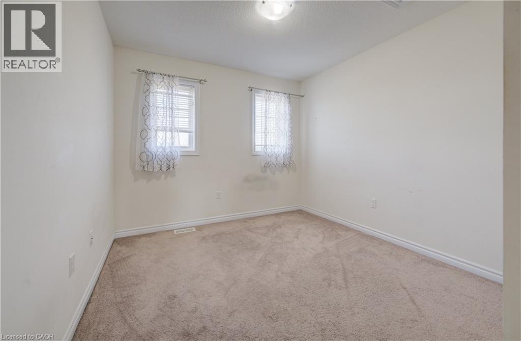 Neutral-toned carpeting paired with light wall paint - 403 Westwood Drive Unit# 59, Kitchener, ON